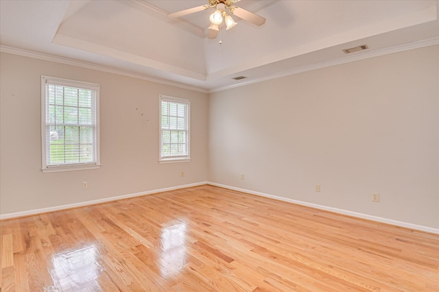 3696 El Cordero Ranch Springs Rd, Augusta, GA 30907 - empty room with a tray ceiling, light wood-style flooring, ceiling fan, baseboards, and crown molding