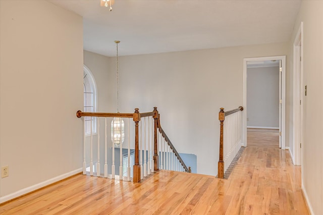 3696 El Cordero Ranch Springs Rd, Augusta, GA 30907 - hallway featuring an upstairs landing, wood finished floors, and baseboards