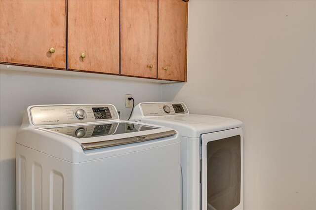3696 El Cordero Ranch Springs Rd, Augusta, GA 30907 - laundry area featuring independent washer and dryer and cabinet space