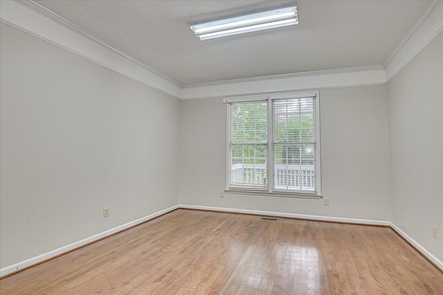 3696 El Cordero Ranch Springs Rd, Augusta, GA 30907 - spare room with crown molding, wood finished floors, and baseboards