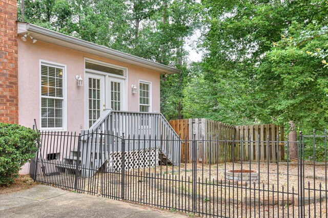 3696 El Cordero Ranch Springs Rd, Augusta, GA 30907 - doorway to property with stucco siding and a gate