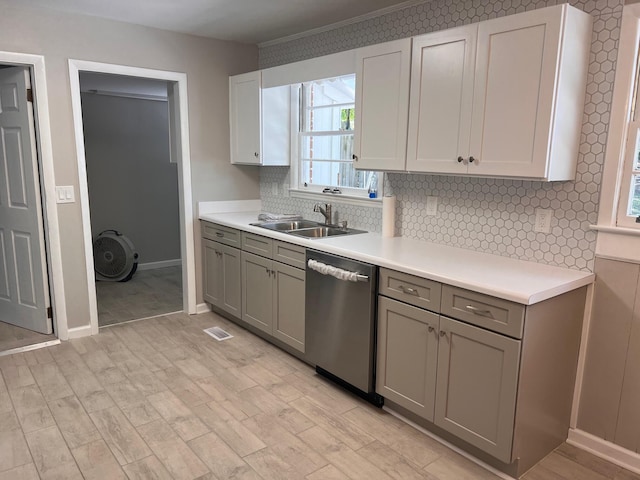 kitchen with gray cabinetry, white cabinetry, sink, and stainless steel dishwasher