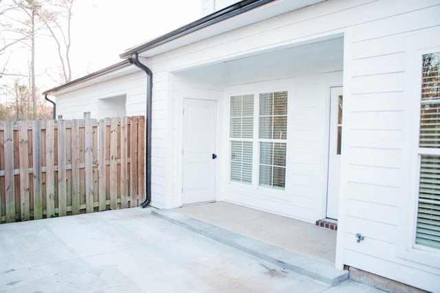 property entrance featuring fence