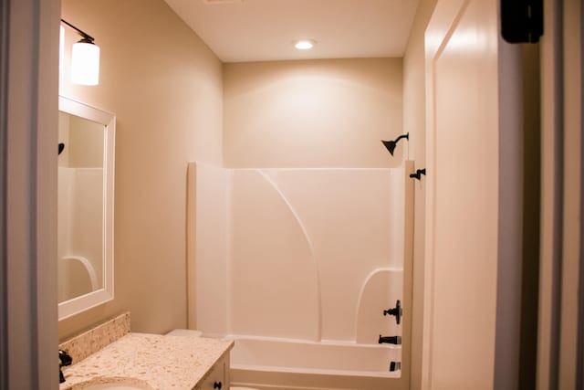 full bathroom featuring shower / bath combination and vanity