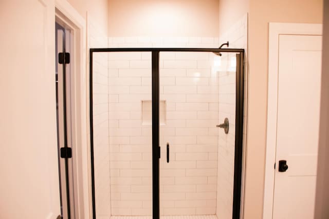 bathroom with a stall shower