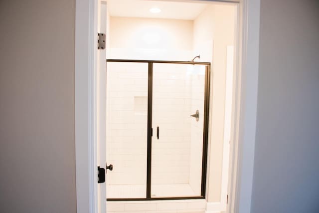 bathroom with a shower stall