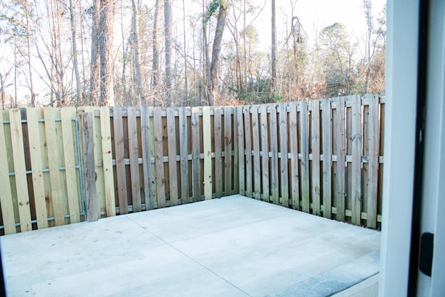 view of patio featuring fence