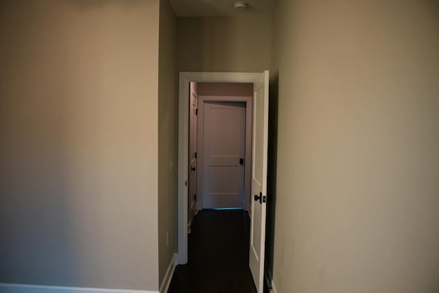 hallway featuring baseboards