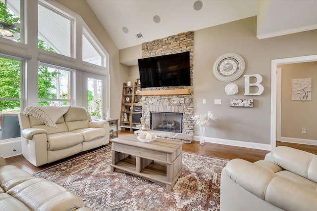 137 Elgin Ln, Mccormick, SC 29835 - living room with wood finished floors, high vaulted ceiling, visible vents, a fireplace, and baseboards