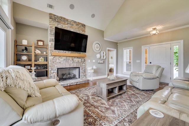 137 Elgin Ln, Mccormick, SC 29835 - living room featuring wood finished floors, a fireplace, visible vents, baseboards, and lofted ceiling