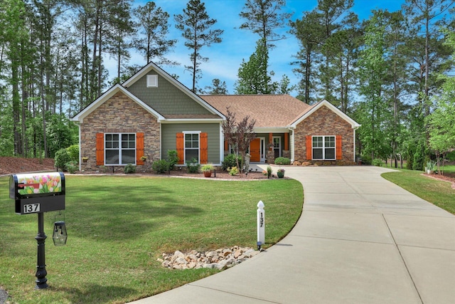 137 Elgin Ln, Mccormick, SC 29835 - craftsman-style house with stone siding, a front yard, and driveway