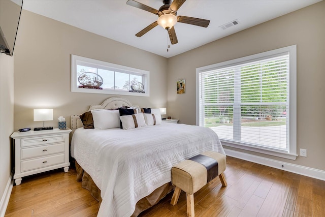 137 Elgin Ln, Mccormick, SC 29835 - bedroom featuring baseboards, light wood-type flooring, visible vents, and multiple windows