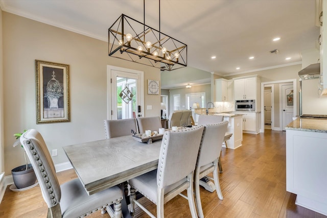 137 Elgin Ln, Mccormick, SC 29835 - dining space featuring light wood finished floors, an inviting chandelier, baseboards, ornamental molding, and recessed lighting