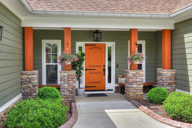 137 Elgin Ln, Mccormick, SC 29835 - entrance to property with a shingled roof, a porch, and stone siding