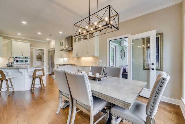 137 Elgin Ln, Mccormick, SC 29835 - dining room with recessed lighting, a wall unit AC, a chandelier, crown molding, and light wood-style floors