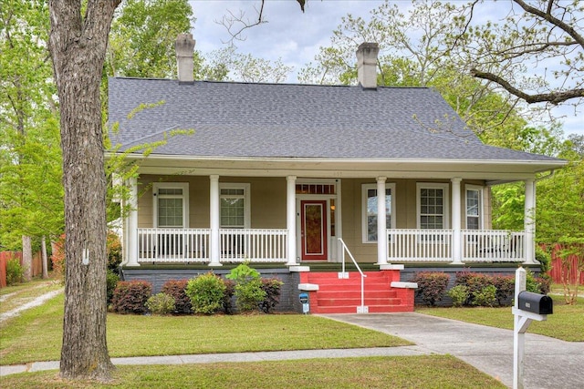 view of front facade with a porch and a front yard