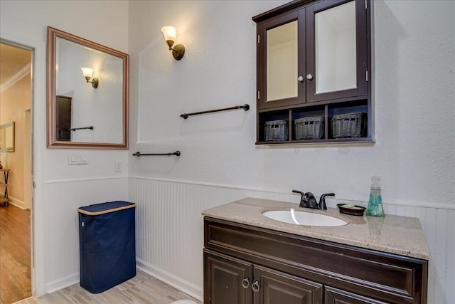 bathroom with vanity and wood-type flooring