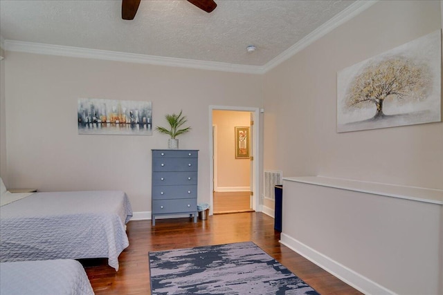 bedroom featuring a textured ceiling, dark hardwood / wood-style floors, ceiling fan, and ornamental molding