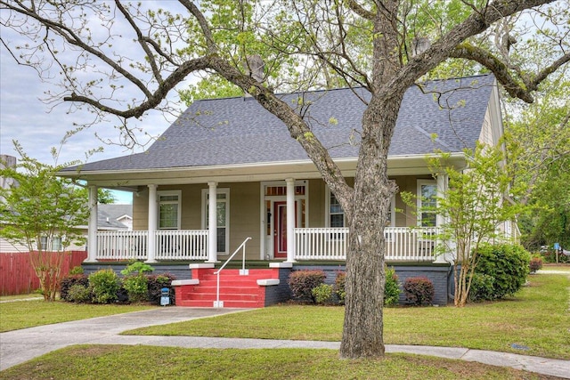 bungalow-style house with a front lawn and a porch