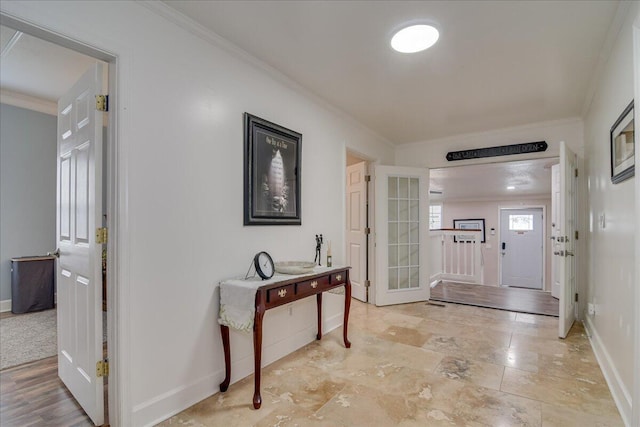 interior space with crown molding and french doors