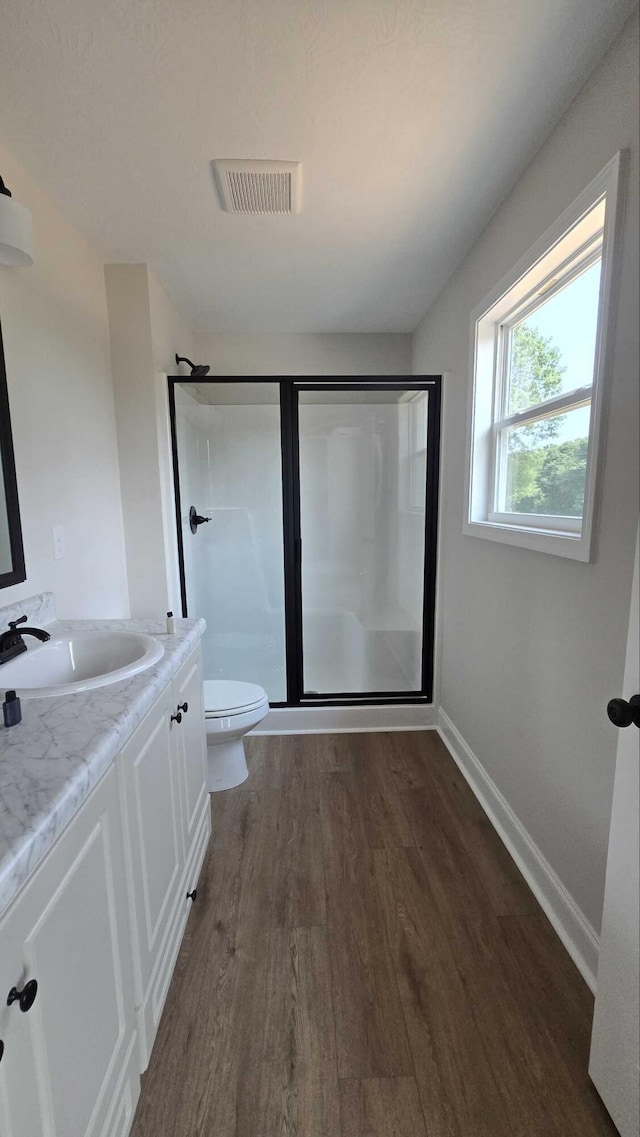 1759 Storm Branch Rd, Beech Island, SC 29842 - full bath featuring wood finished floors, a shower stall, and vanity
