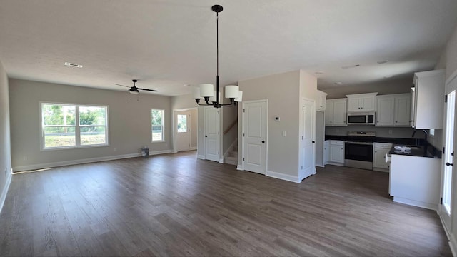 1759 Storm Branch Rd, Beech Island, SC 29842 - kitchen with appliances with stainless steel finishes, open floor plan, dark countertops, and dark wood finished floors