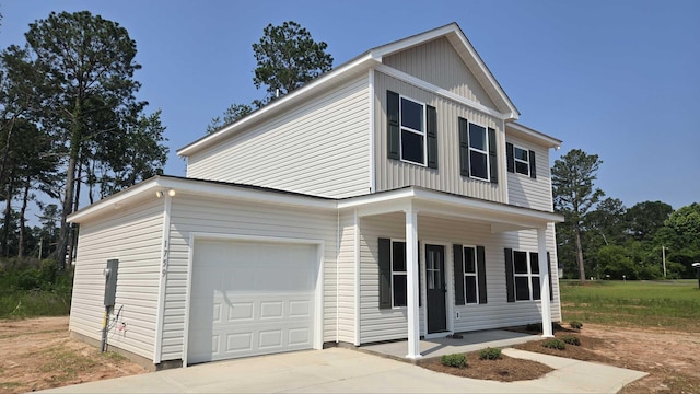 1759 Storm Branch Rd, Beech Island, SC 29842 - view of front facade featuring a porch, a garage, concrete driveway, and board and batten siding