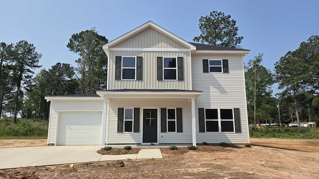 1759 Storm Branch Rd, Beech Island, SC 29842 - view of front facade with board and batten siding, a garage, concrete driveway, and a porch