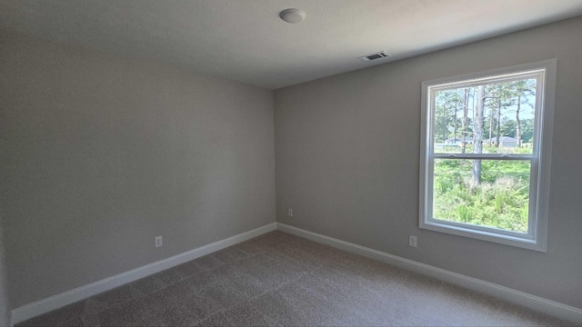 1759 Storm Branch Rd, Beech Island, SC 29842 - spare room featuring dark colored carpet and baseboards