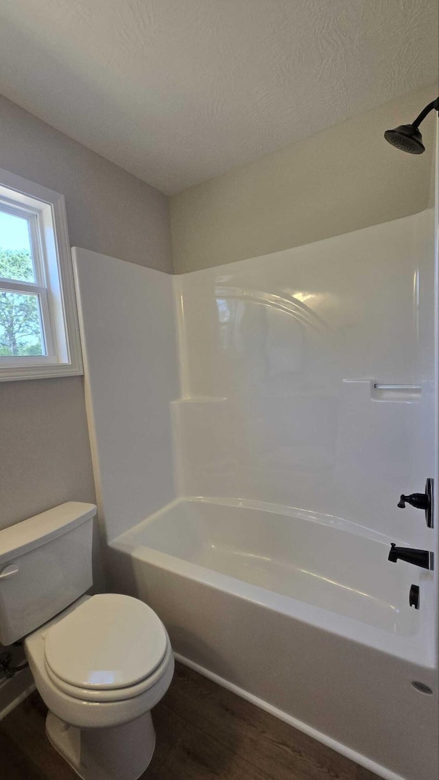 1759 Storm Branch Rd, Beech Island, SC 29842 - bathroom featuring wood finished floors, washtub / shower combination, and a textured ceiling