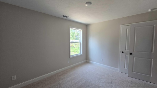 1759 Storm Branch Rd, Beech Island, SC 29842 - unfurnished bedroom with light colored carpet and a closet