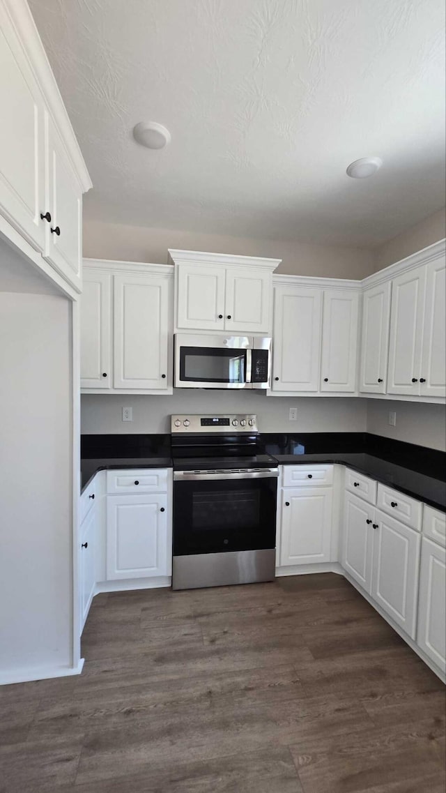 1759 Storm Branch Rd, Beech Island, SC 29842 - kitchen featuring stainless steel appliances, dark countertops, and white cabinets