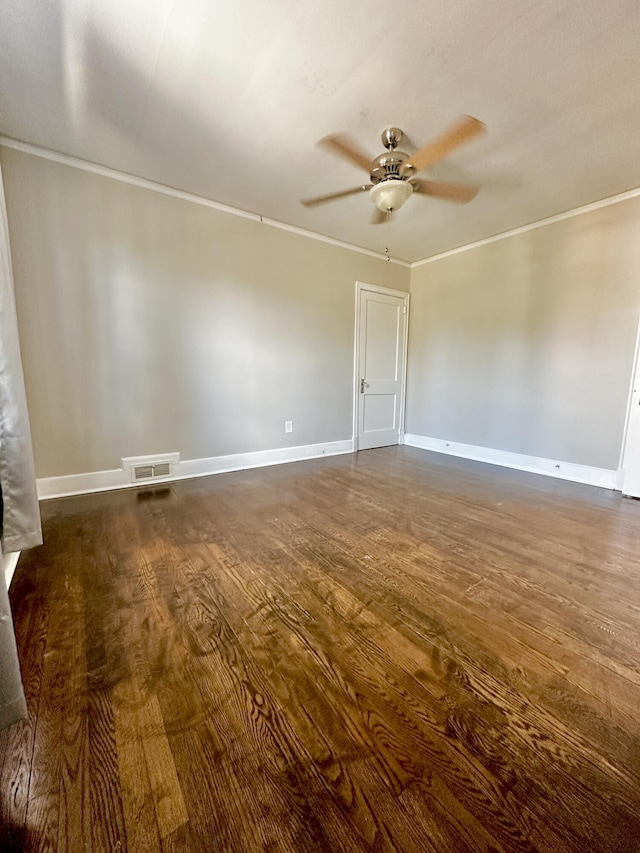 unfurnished room with baseboards, a ceiling fan, dark wood-style flooring, and crown molding