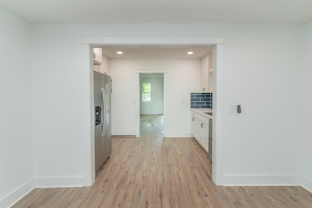 hall with light hardwood / wood-style floors