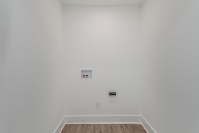 laundry room featuring washer hookup, hookup for an electric dryer, and wood-type flooring