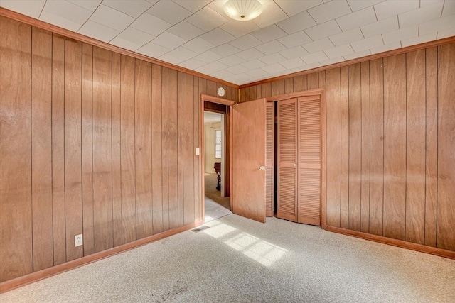 1775 Metasville Rd, Lincolnton, GA 30817 - empty room featuring wood walls, baseboards, visible vents, and light colored carpet