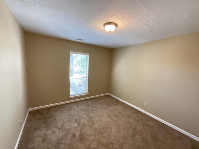 930 Hunting Horn Way, Evans, GA 30809 - carpeted spare room featuring baseboards and a textured ceiling