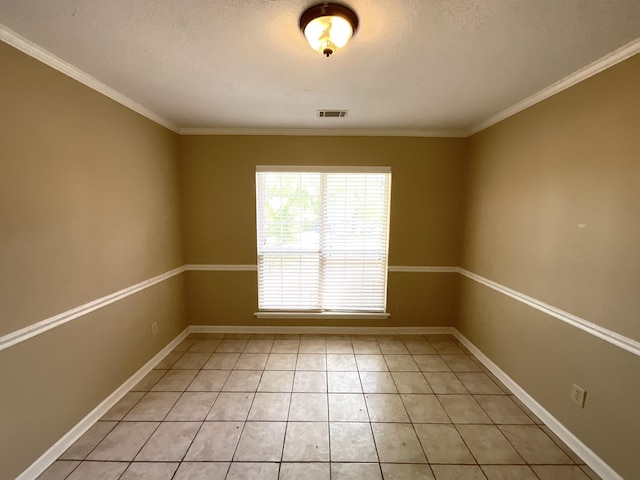 930 Hunting Horn Way, Evans, GA 30809 - spare room with light tile patterned floors, ornamental molding, a textured ceiling, and baseboards