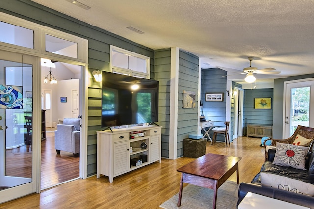 123 Tara Dr, Mccormick, SC 29835 - living area with a textured ceiling, wood finished floors, and a ceiling fan