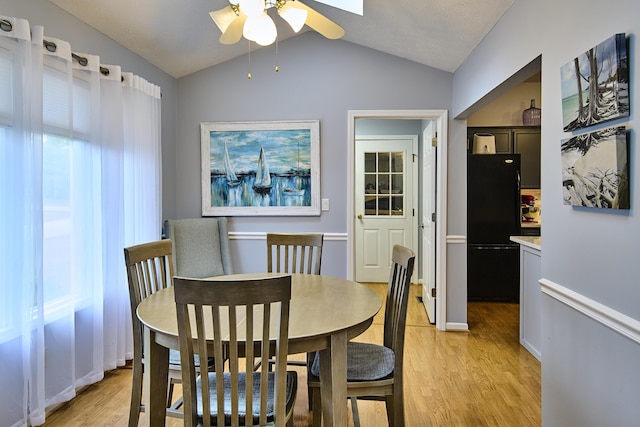123 Tara Dr, Mccormick, SC 29835 - dining space with light wood-style flooring, ceiling fan, and vaulted ceiling