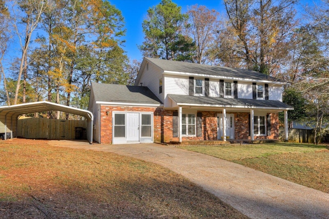 view of front of property featuring a carport and a front yard