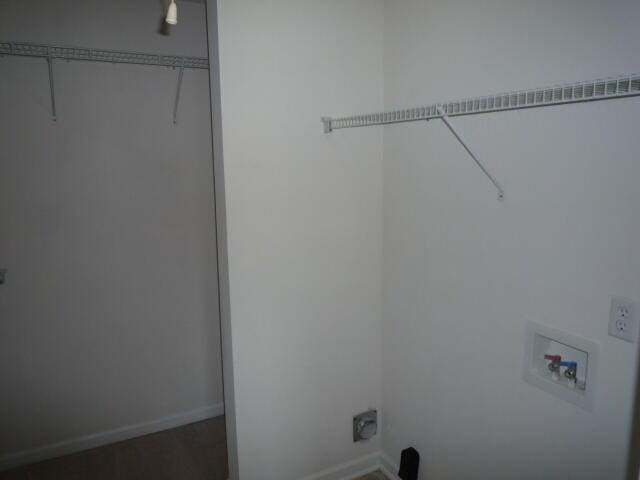 7423 Exuma Dr, Augusta, GA 30909 - clothes washing area with baseboards, hookup for a washing machine, and laundry area
