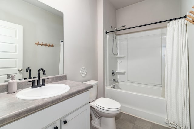 full bath featuring vanity, shower / bath combo, and toilet