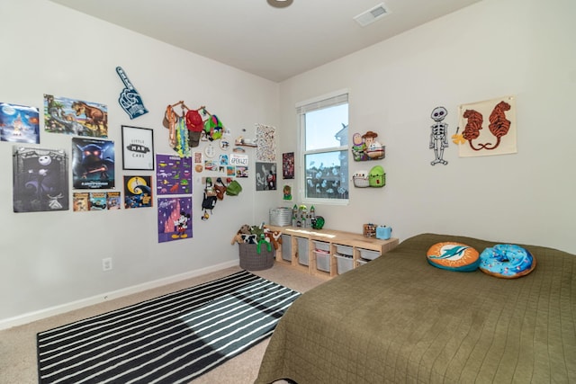 bedroom with carpet floors, baseboards, and visible vents