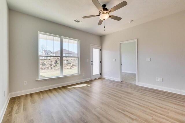 unfurnished room with dark colored carpet, visible vents, a textured ceiling, and baseboards