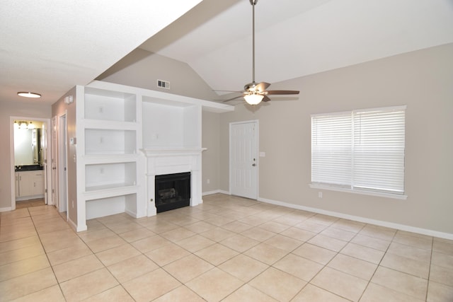 unfurnished living room with light tile patterned floors, a fireplace, visible vents, baseboards, and built in features