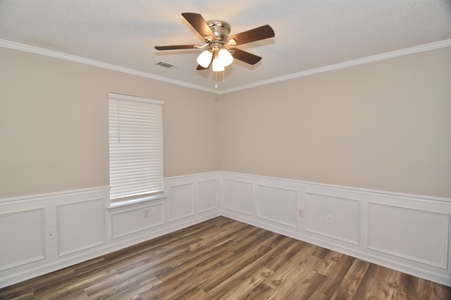 spare room with dark wood-type flooring, visible vents, a textured ceiling, and a ceiling fan