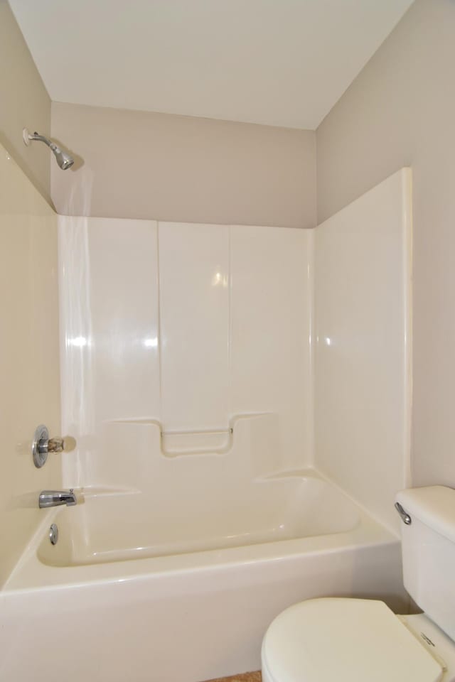 full bath with washtub / shower combination and toilet