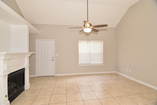 unfurnished living room with lofted ceiling, ceiling fan, a fireplace, and baseboards