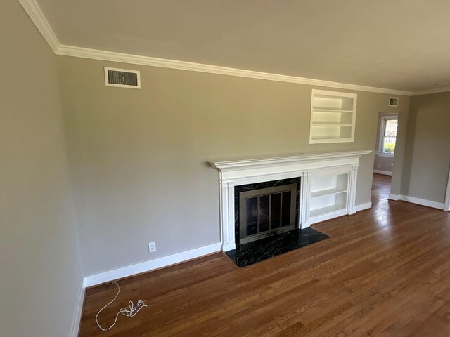 2210 Glendale Rd, Augusta, GA 30904 - unfurnished living room with baseboards, visible vents, wood finished floors, and crown molding